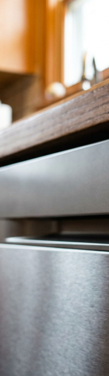 A close-up of a dishwasher's digital display showing that the wash cycle will take over three hours.
