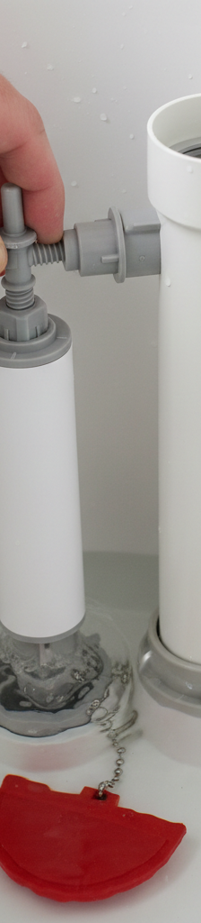 Homeowner adjusting fill valve and float in a toilet tank to stop a running toilet.