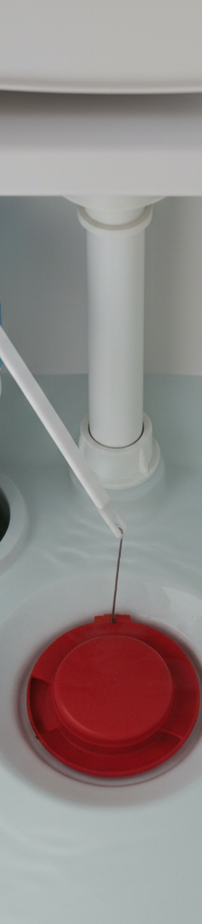 Inside view of a running toilet tank showing the flapper, fill valve, and float mechanism.
