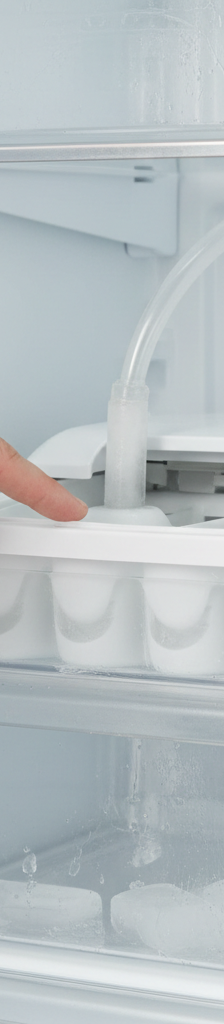 Person diagnosing a refrigerator ice maker with a frozen fill tube inside the freezer compartment