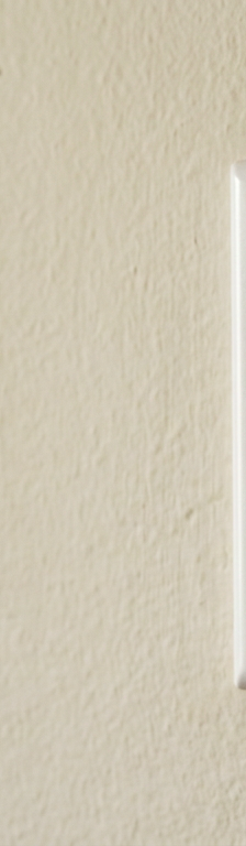 A non-working white light switch on a wall, stuck in the on position but the light is not on.