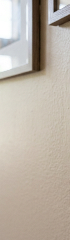 A smart thermostat on a wall that keeps changing the temperature on its own