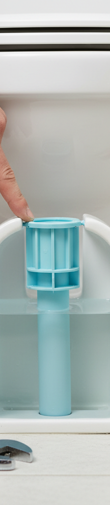 Homeowner inspecting and fixing a slow-filling toilet tank's fill valve.