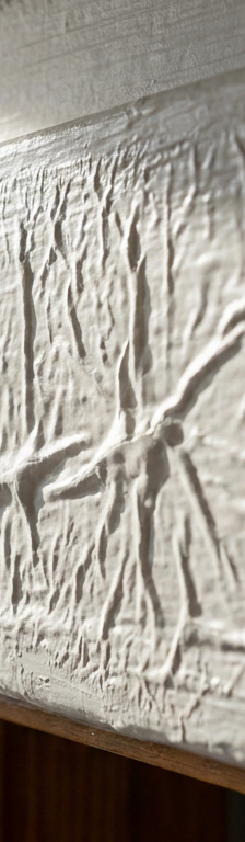 Close-up of wrinkled and puckered fresh paint on an interior wall trim board